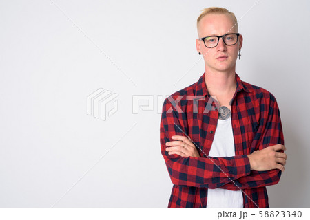 Portrait of young blonde hipster man with arms crossed 58823340