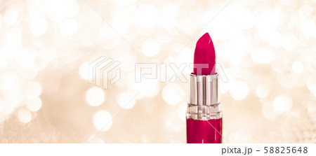 Maroon lipstick on golden Christmas, New Years and 58825648