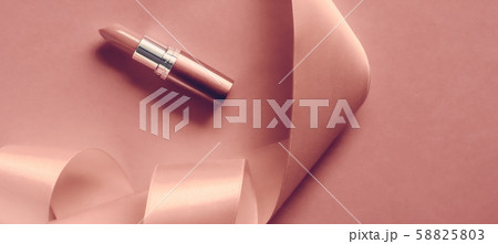 Luxury lipstick and silk ribbon on blush pink Luxury lipstick and silk ribbon on blush pink 58825803
