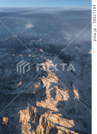 Clouds and sunset plane window view in Caucasus Clouds and sunset plane window view in Caucasus 58827284