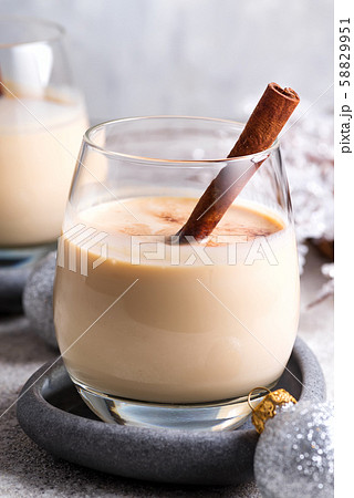 Winter spicy hot drink eggnog in a glasses with 58829951