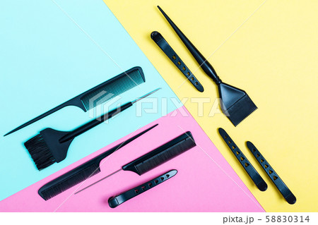 Combs and bleach brushes on pastel colored paper Combs and bleach brushes on pastel colored paper 58830314