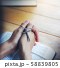Cross on praying hand of Women faith jesus promise 58839805