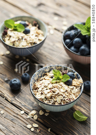 Mix of homemade cereal with blueberry and mint Mix of homemade cereal with blueberry and mint 58840850