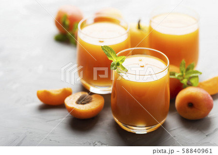 Fresh apricot juice on the marble table Fresh apricot juice on the marble table 58840961