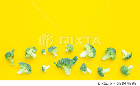 Fresh broccoli on yellow background. 58844898
