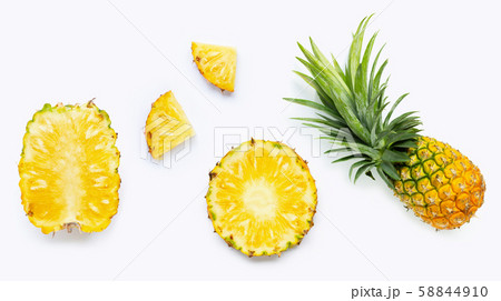 Fresh whole and cut pineapple isolated on white Fresh whole and cut pineapple isolated on white 58844910