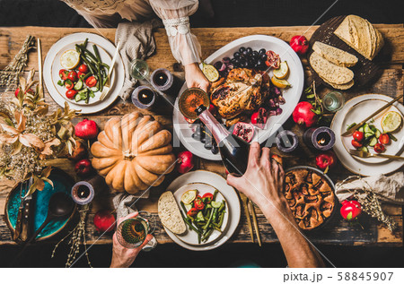 People pouring champagne and celebrating 58845907