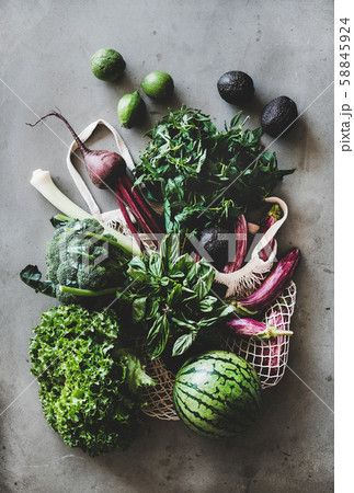 Healthy grocery goods in net bag over concrete Healthy grocery goods in net bag over concrete 58845924