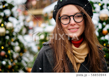 Close-up portrait of happy girl in beret enjoying winter moments. Outdoor photo of long-haired Close-up portrait of happy girl in beret enjoying winter moments. Outdoor photo of long-haired 58850944