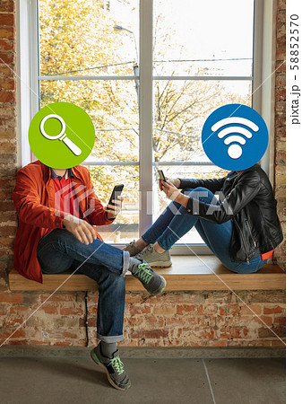Creative millenial people connecting and sharing social media. Modern UI icons as heads 58852570