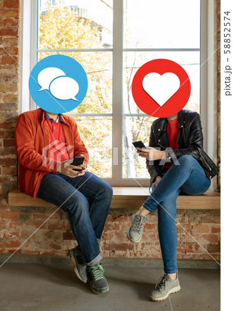 Creative millenial people connecting and sharing social media. Modern UI icons as heads 58852574
