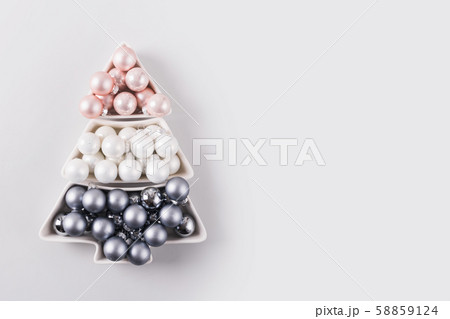Christmas tree of silver pastel balls on grey 58859124