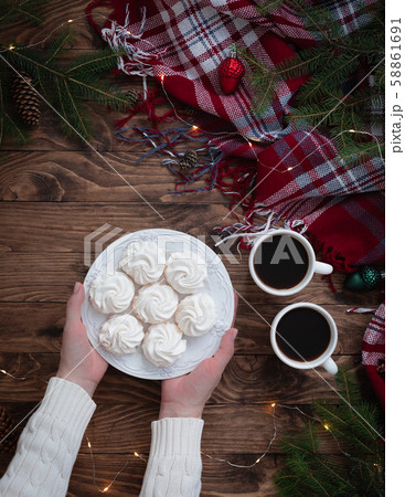 Christmas coffee cups with woman hands holding 58861691