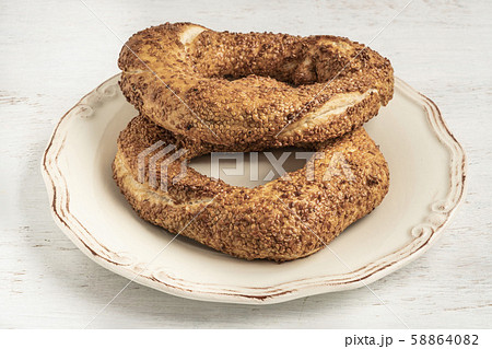 crispy Turkish bagel, simit on a wooden table crispy Turkish bagel, simit on a wooden table 58864082