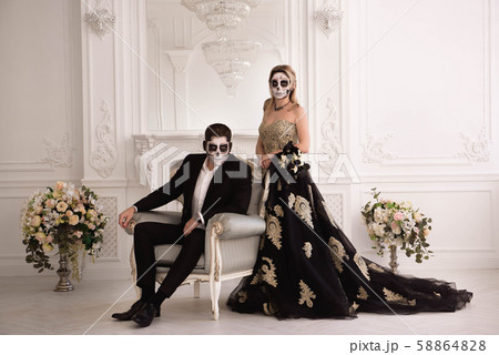 A couple with skeleton make up for Halloween or All Souls Day 58864828