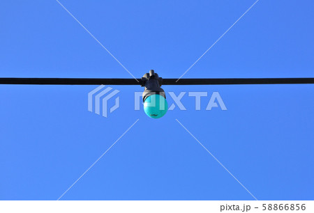 Colored street lamp without lampshade on a wire Colored street lamp without lampshade on a wire 58866856
