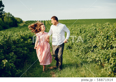 Beautiful couple spend time on a summer field 58871914