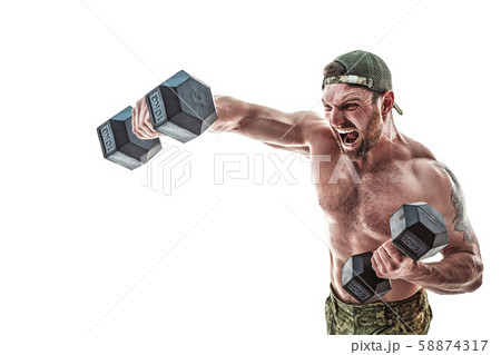 Muscular athlete bodybuilder man in camouflage pants with a naked torso punching with dumbbells like Muscular athlete bodybuilder man in camouflage pants with a naked torso punching with dumbbells like 58874317