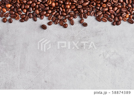 Coffee beans isolated on a grey concrete background. 58874389