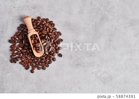 Coffee beans isolated on a grey concrete background. 58874391