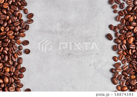 Coffee beans isolated on a grey concrete background. Coffee beans isolated on a grey concrete background. 58874393