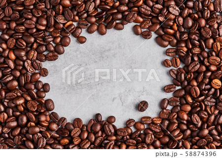 Coffee beans isolated on a grey concrete background. 58874396