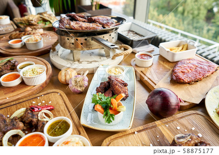 Barbecue restaurant menu. Many different food on the table. Dinner party or Banquet. Barbecue restaurant menu. Many different food on the table. Dinner party or Banquet. 58875177