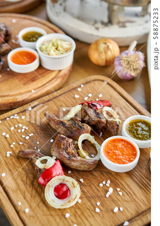 Lamb tongue kebab with Pickled cabbage and two sauces. Barbecue restaurant menu. Many different food Lamb tongue kebab with Pickled cabbage and two sauces. Barbecue restaurant menu. Many different food 58875233