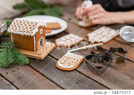 Christmas homemade gingerbread cookies on wooden table. Icing of Christmas bakery. closeup, copy 58875477