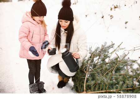 Mother and daughter in a winter park Mother and daughter in a winter park 58878908