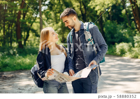 Cute couple have a rest in a summer forest 58880352