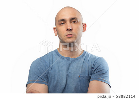 Photo of young shaved man on white 58882114