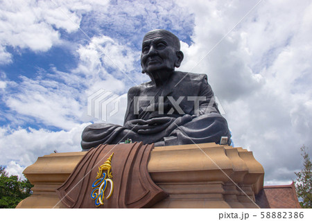 The Giant Luang Phor Thuad Statue is the world largest black monk and famous in Prachuap Khiri Khan Province. 58882386