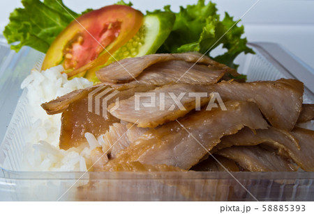 Roasted pork and rice in a plastic box 58885393