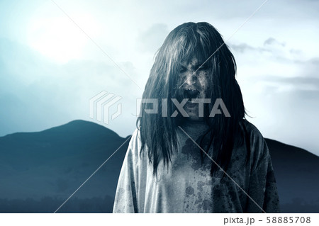 Scary ghost woman with blood and angry face 58885708