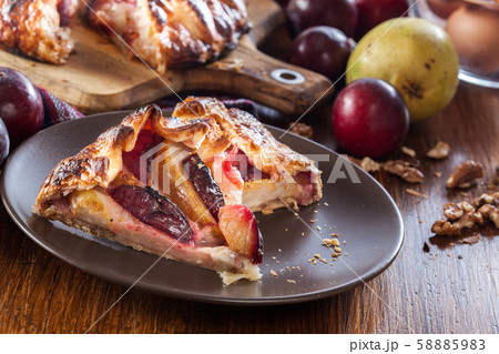 Portion of galette with pears and plums Portion of galette with pears and plums 58885983