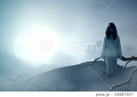 Scary ghost woman with blood and dirty face 58887027