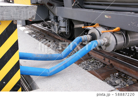 Refill the brake fluid in a railway carriage parked train 58887220