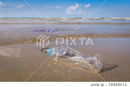 Plastic bottle or garbage on beach Plastic bottle or garbage on beach 58888013