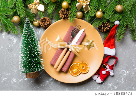Top view of fork, knife and plate surrounded with Top view of fork, knife and plate surrounded with 58888472