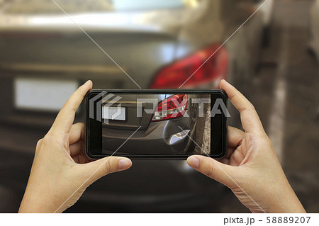 Close up hand holding smartphone and take photo at 58889207