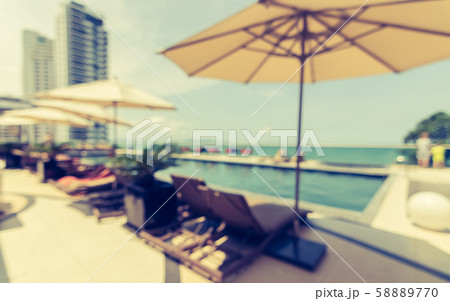 Blur summer background poolside party with tropical resort hotel swimming pool place Blur summer background poolside party with tropical resort hotel swimming pool place 58889770