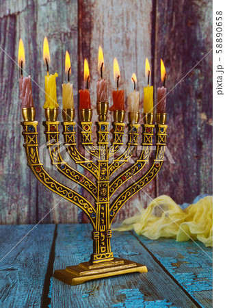 Hanukkah menorah with burning candles 58890658