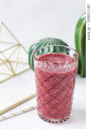 Red beet, blueberry and strawberry smoothie in a glass Red beet, blueberry and strawberry smoothie in a glass 58891180