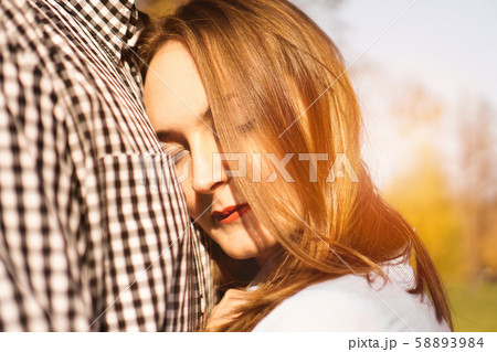 Romantic couple in the autumn park - love, relationship and dating concept Romantic couple in the autumn park - love, relationship and dating concept 58893984