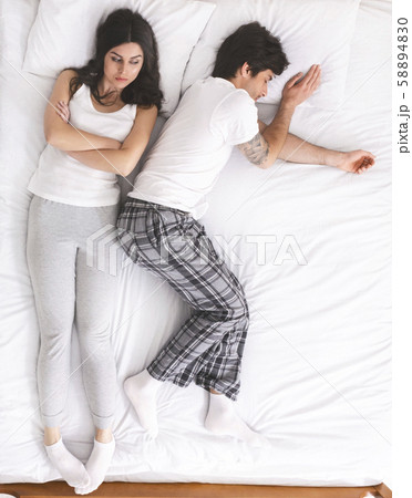 Unsatisfied woman can't sleep because of her boyfriend Unsatisfied woman can't sleep because of her boyfriend 58894830