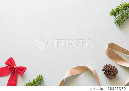 Christmas background with gift boxes, pine cone and decorations on light blue background. Preparation for holidays. Top view with copy space. Christmas background with gift boxes, pine cone and decorations on light blue background. Preparation for holidays. Top view with copy space. 58895370