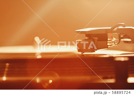Close up of turntable needle on a vinyl record. Close up of turntable needle on a vinyl record. 58895724