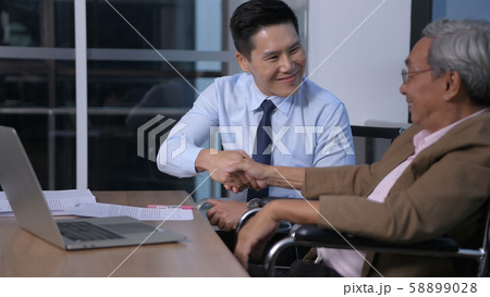 Business concepts. An old man is signing a 58899028